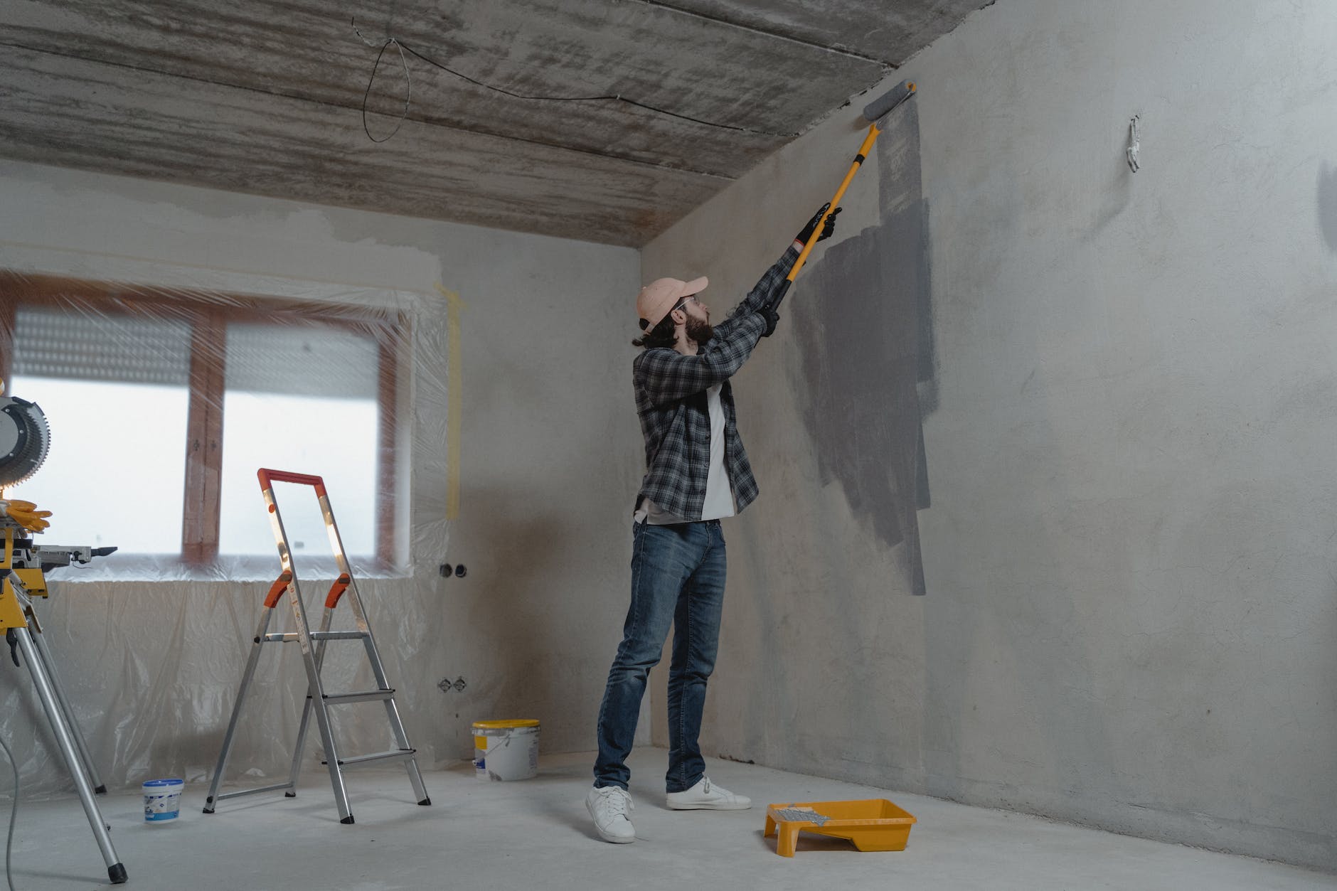 man painting the wall